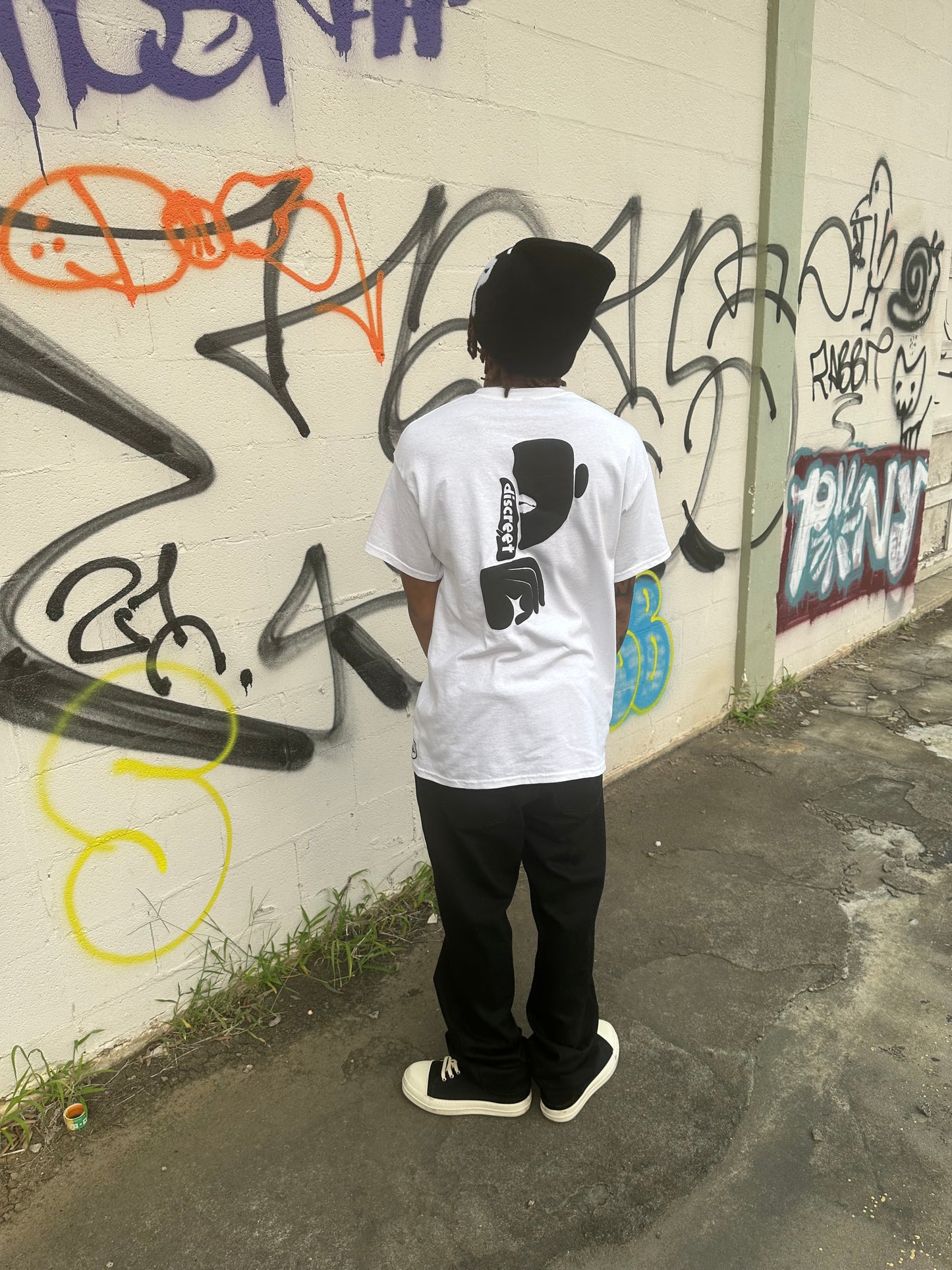 Discreet Alternate Black on White Tee